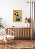 Aranżacja wnętrza, na ścianie wisi plakat w ramce: do pokoju dziecięcego zebra safari na pomarańczowym tle