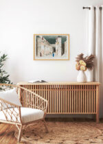 Aranżacja wnętrza, na ścianie wisi plakat w ramce: Świątynia egipska Belzoni odkrycia archeologiczne