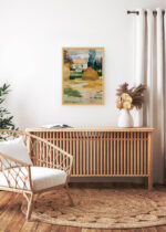 Aranżacja wnętrza, na ścianie wisi plakat w ramce: Paul Gauguin pejzaż wiejski chaty stóg siana