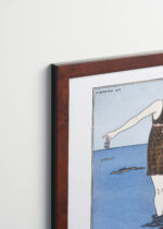 Aranżacja wnętrza, na ścianie wisi plakat w ramce: Art Deco kobieta na plaży George Barbier 1913