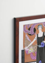Aranżacja wnętrza, na ścianie wisi plakat w ramce: La Belle Dame Sans Merci George Barbier Art Deco