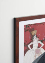 Aranżacja wnętrza, na ścianie wisi plakat w ramce: Le Jour et la Nuit George Barbier Art Deco