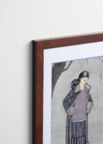 Aranżacja wnętrza, na ścianie wisi plakat w ramce: Le Belvédère George Barbier Art Deco vintage