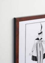 Aranżacja wnętrza, na ścianie wisi plakat w ramce: Kobieta z motylami George Barbier art déco 1914