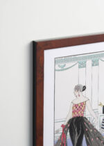 Aranżacja wnętrza, na ścianie wisi plakat w ramce: La Toilette Délicieuse George Barbier Art Deco 1921