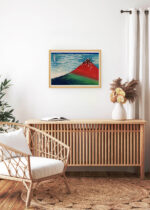 Aranżacja wnętrza, na ścianie wisi plakat w ramce: Czerwony Fuji Katsushika Hokusai japońska sztuka 1830