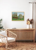 Aranżacja wnętrza, na ścianie wisi plakat w ramce: Łąka Henri Rousseau pejzaż wiejski z bydłem i pasterzem