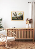 Aranżacja wnętrza, na ścianie wisi plakat w ramce: Cietrzew preriowy - John James Audubon Birds of America