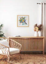 Aranżacja wnętrza, na ścianie wisi plakat w ramce: Wassily Kandinsky Małe Światy IV (Kleine Welten IV) abstrakcja