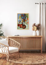 Aranżacja wnętrza, na ścianie wisi plakat w ramce: Kirchner Martwa natura z dzbanem i afrykańską misą