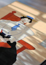 Zbliżenie na detale plakatu: Kobieta na czerwonym fotelu bujanym (ok. 1895)