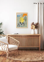 Aranżacja wnętrza, na ścianie wisi plakat w ramce: Mężczyzna na rowerze (1894)