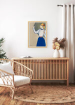 Aranżacja wnętrza, na ścianie wisi plakat w ramce: Kobieta trzymająca parasol nad głową (1897)