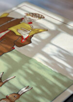 Zbliżenie na detale plakatu: Mężczyzna czytający książkę z zającami (1895)